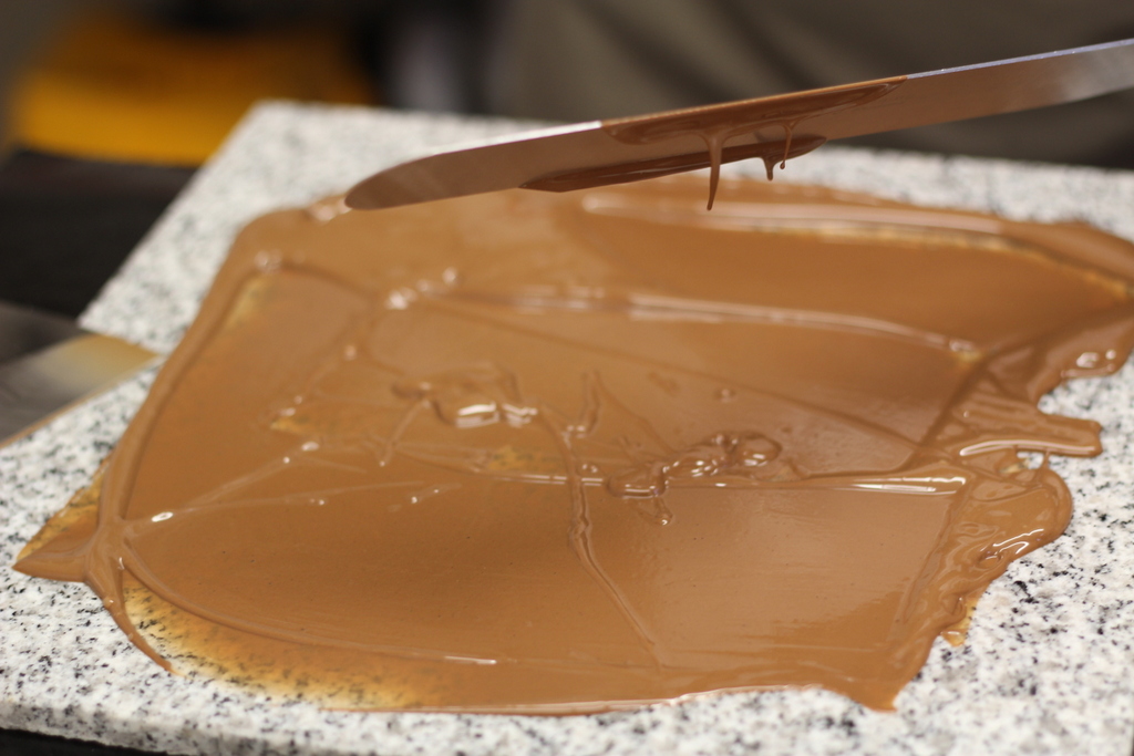 Tempering chocolate technique during the Tempering Chocolate Workshop