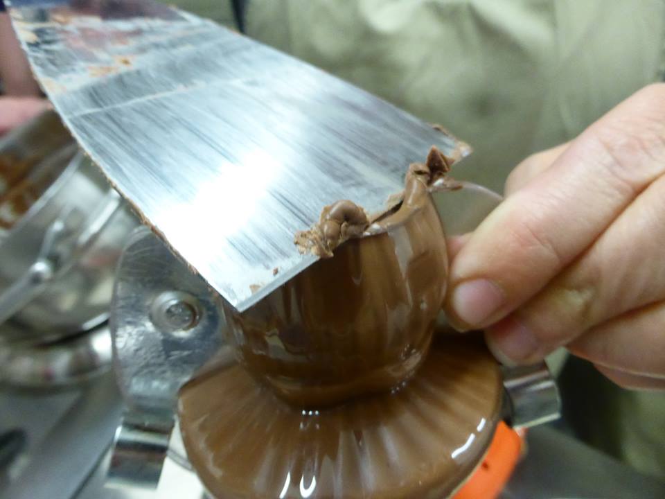 Molding chocolate during the Tempering Chocolate Workshop